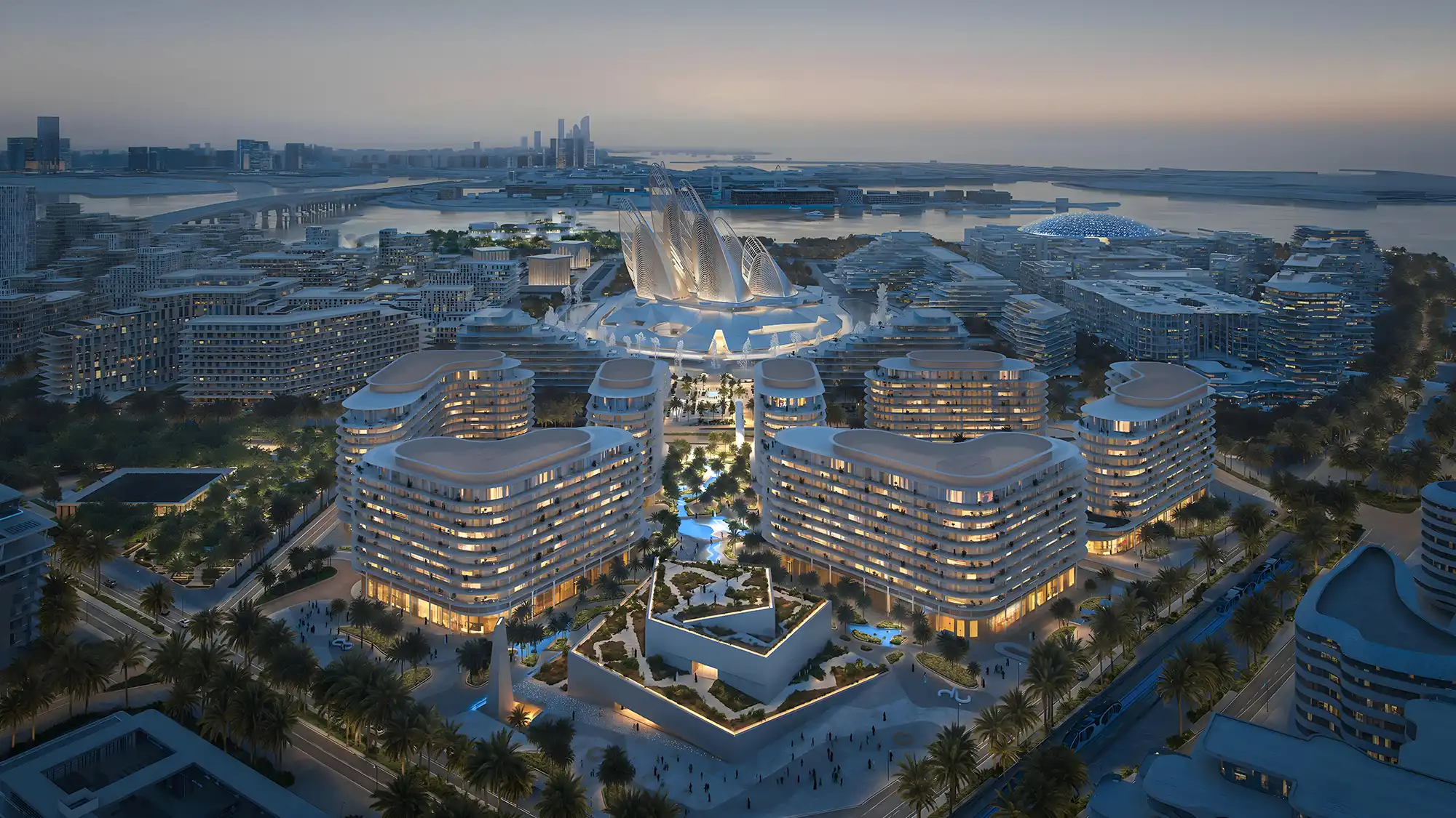 Aerial night view of The Row Saadiyat by Aldar in Abu Dhabi, luxury beachfront residences promoted by ELIVA Real Estate near the Zayed National Museum and Louvre Abu Dhabi.